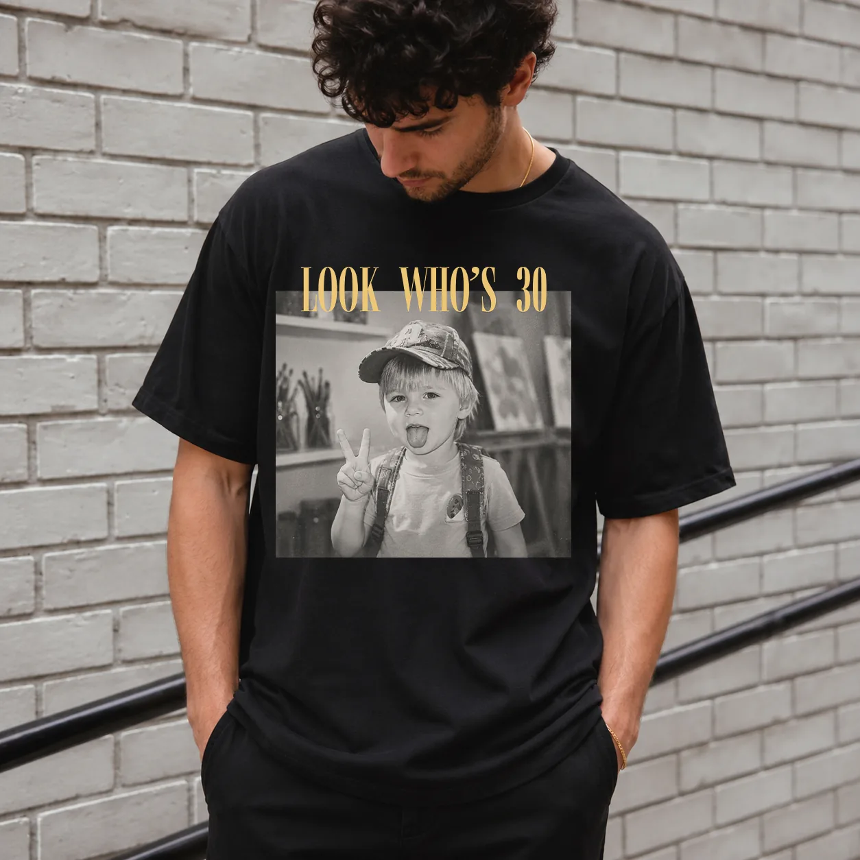 Personalized birthday shirt worn by a male model in Comfort Colors Black