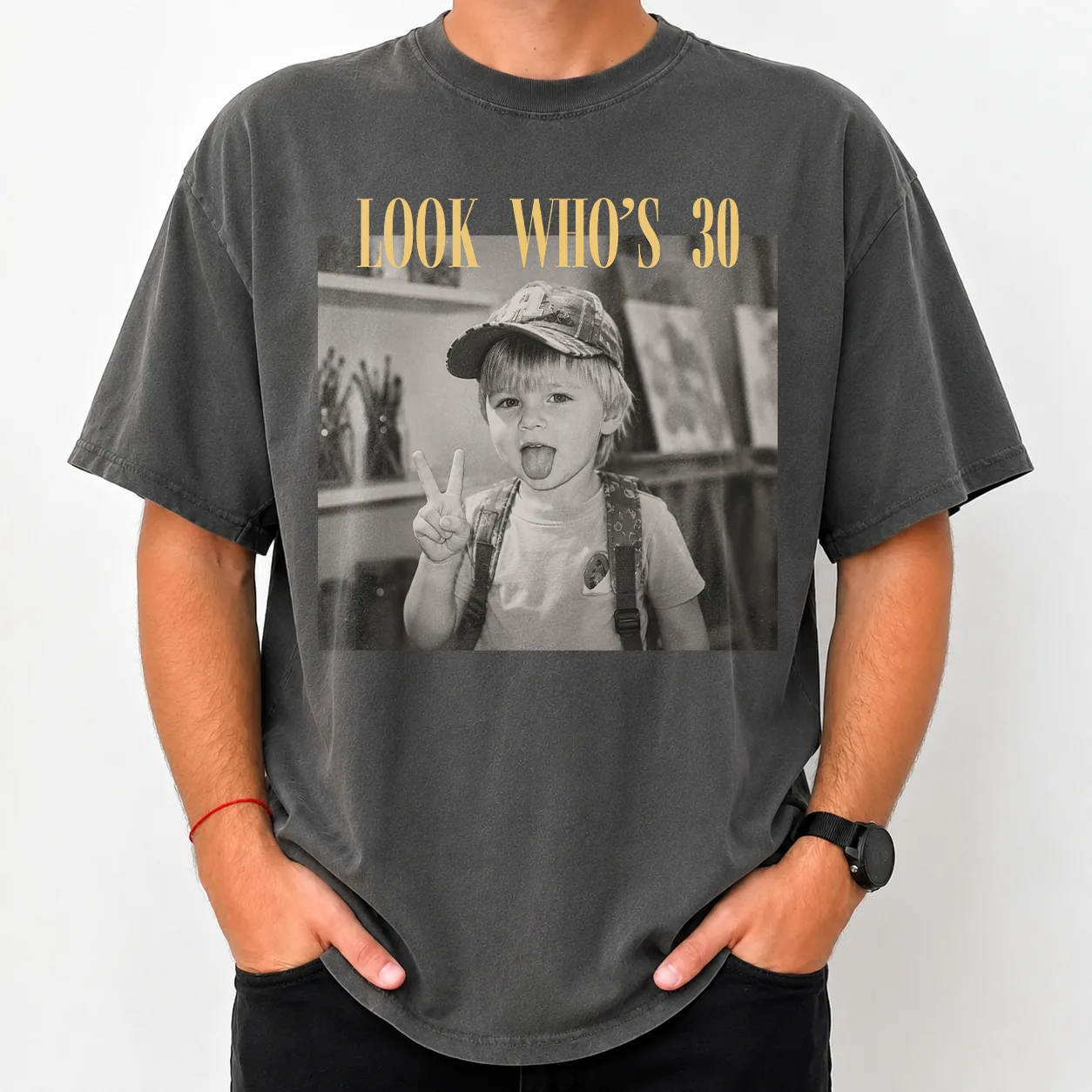 Close-up front detail of the birthday shirt — gold headline above a black-and-white photo