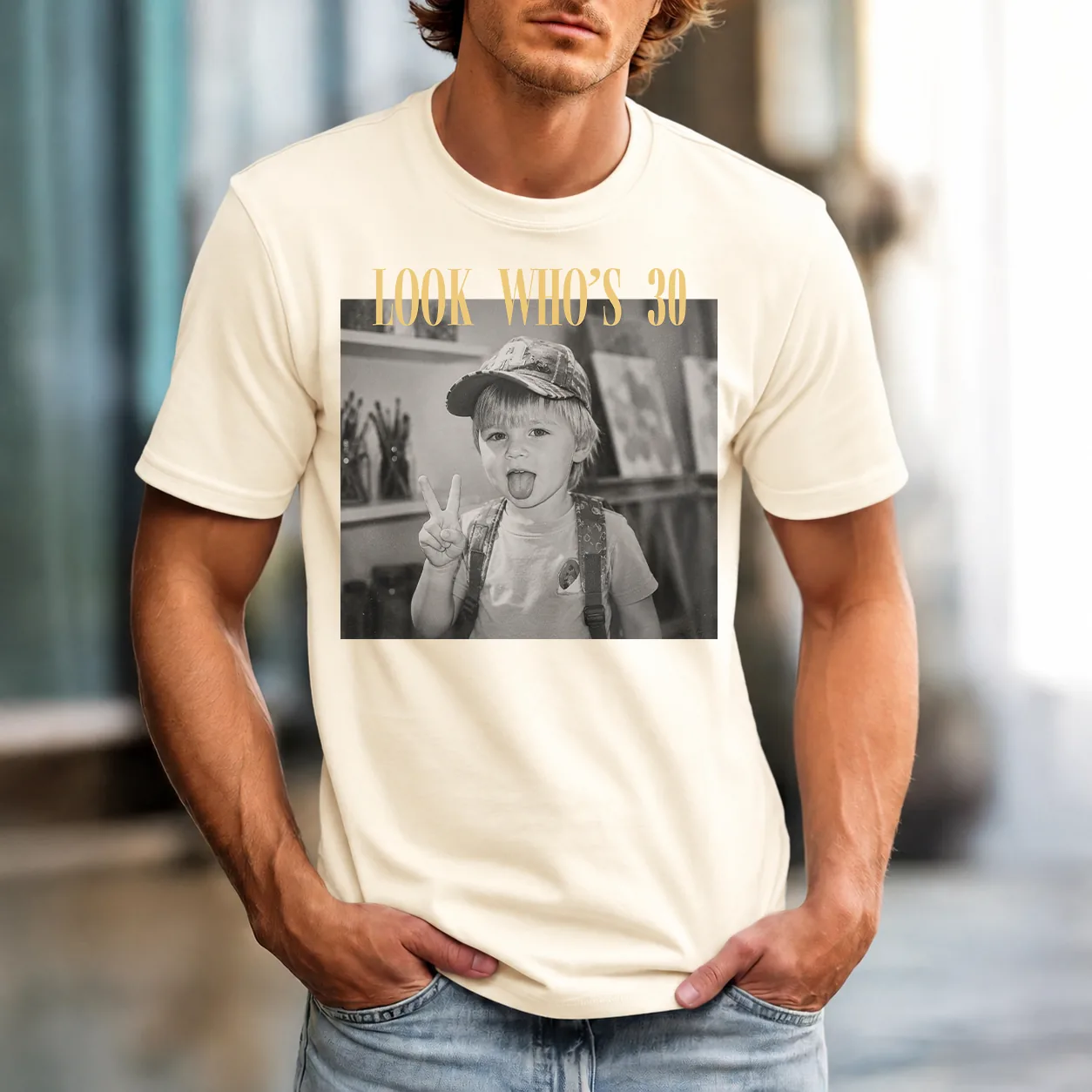 Personalized birthday shirt worn by a male model in Comfort Colors Ivory (cream)